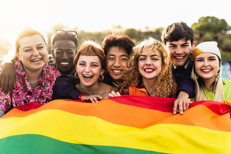 Group of young people with pride flag.